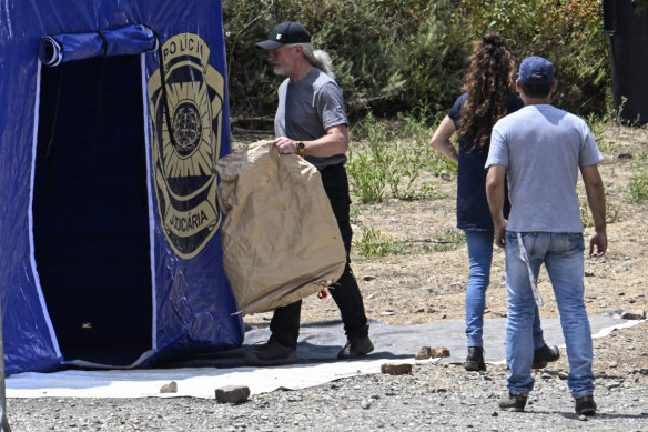 German and Portuguese police investigators at the search site on Thursday.