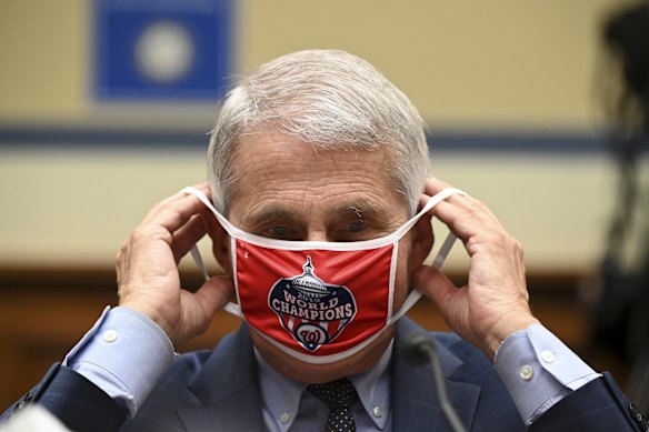 Fauci with a Washington Nationals baseball team mask, which Trump ridiculed in a series of tweets.