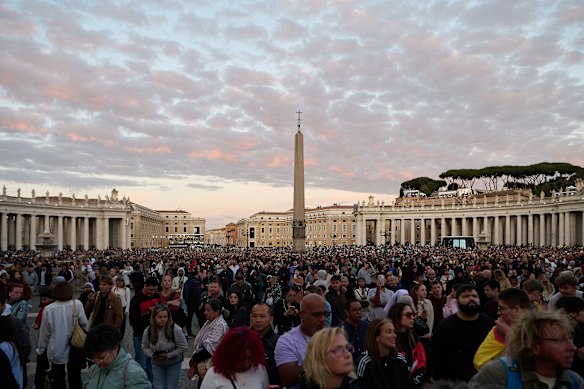 The faithful gather and watch for smoke from the chimney of the Sistine Chapel as the papal conclave gets underway.