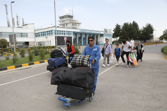 Passengers get screened outside the main terminal as a safety precaution against suicide bombers. 