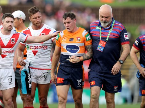 Newcastle’s Kurt Mann is helped off after a heavy hit on Sunday.