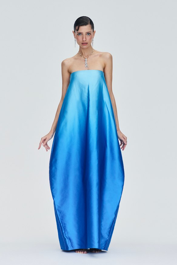 Common Hours “Entourage” gown, $2200. Cartier “Panthère de Cartier” earrings, pendant necklace and ring.