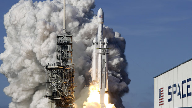 A Falcon 9 SpaceX heavy rocket lifts off from pad 39A at the Kennedy Space Center in Cape Canaveral, Florida.
