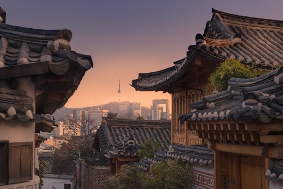 Bukchon Hanok village with Seoul city background