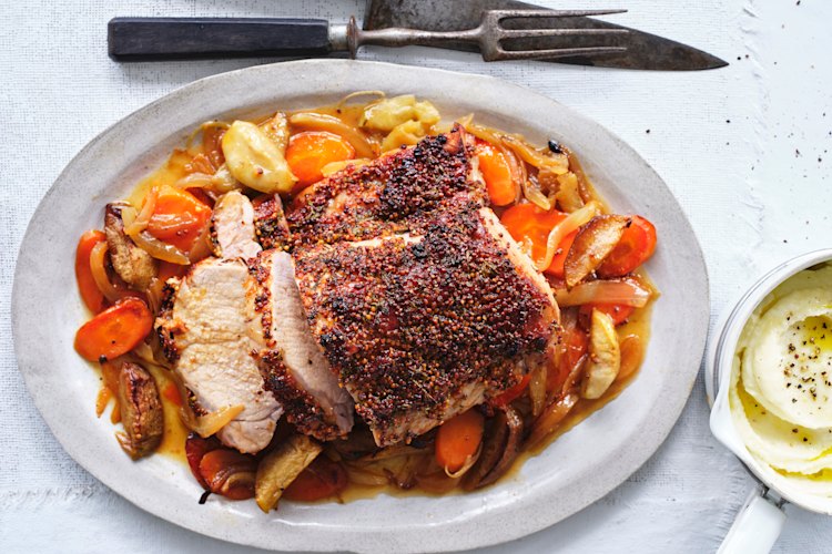 Serve the pork on a bed of the roasted apple, onion and carrot.