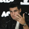 Carlos Alcaraz speaks to reporters after his quarter-final loss to Novak Djokovic.