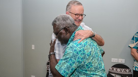 Solomon Islands Prime Minister Manasseh Sogavare greets Anthony Albanese at the Pacific Islands Forum in Fiji.