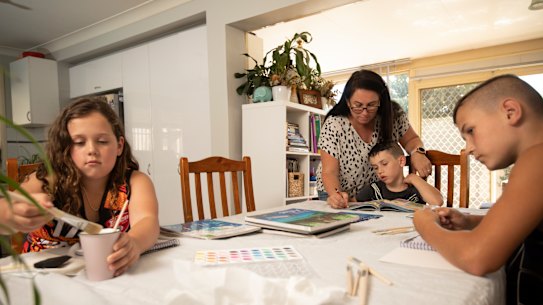 Sara Taylor home schooling her children Genevieve, 9, Alexander. 6,  and Sebastian, 11.