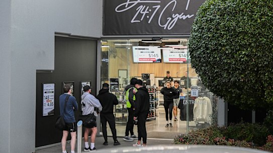 People line up outside a new 24/7 gym in Oakleigh East.