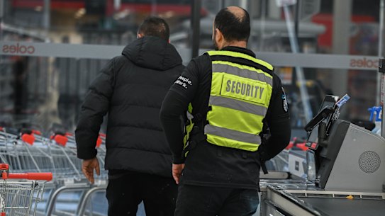 A security guard confronts a man for stealing at Coles Prahran.