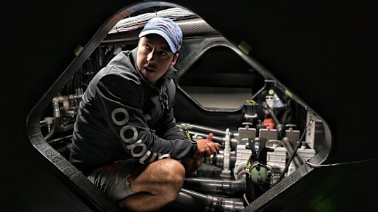 Andoo Comanche team manager Sam Fay in the engineering section of the boat.