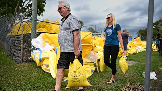 Residents collect sandbags from a council depot in Morningside.