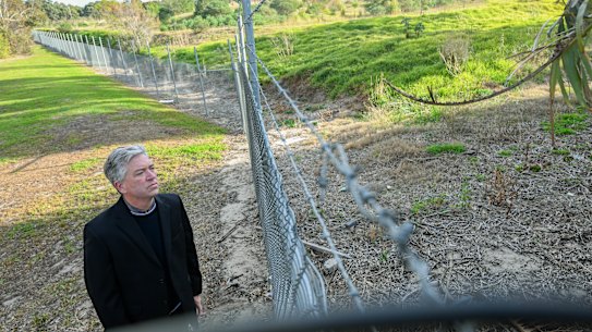 Curt Thompson, who has long fought plans build homes on the former Talbot quarry, stands at the southern boundary of the site.