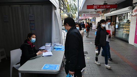 A marquee outside Priceline at Cabramatta is offering information to the local community about AstraZeneca shots available inside.