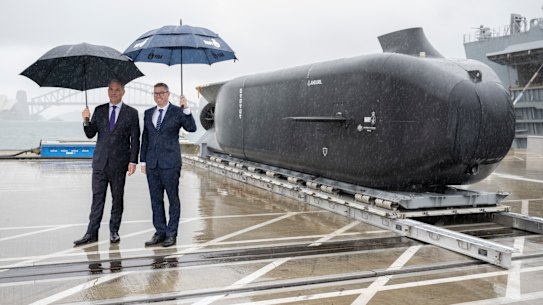 Deputy Prime Minister Richard Marles and Minister for Defence Industry Pat Conroy at the unveiling of the Ghost Shark, an uncrewed submarine, at Garden Island, Sydney.