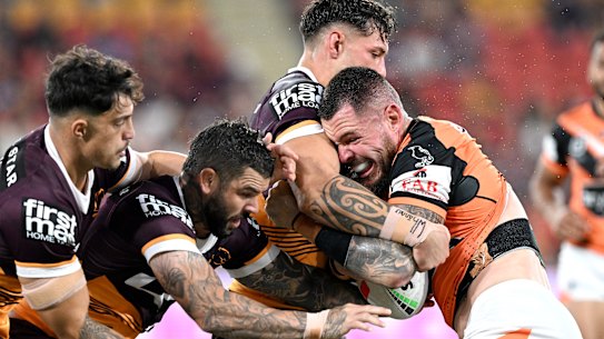 Tigers forward David Klemmer meets a Broncos defensive brick wall.