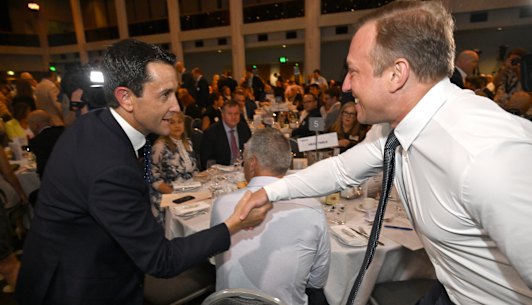 David Crisafulli and Steven Miles shake hands before the debate.