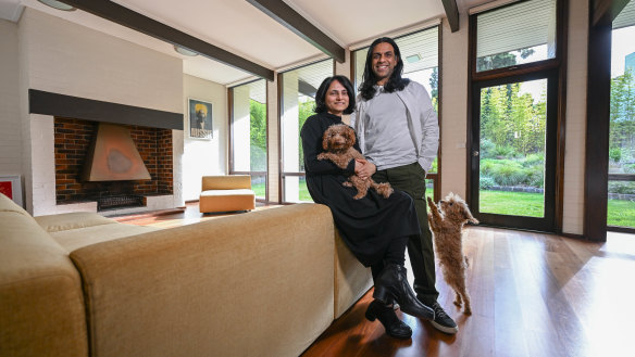 Onisha and Veeral Patel and their dogs Cipo and Hachi in their Robin Boyd designed home in Vermont. 