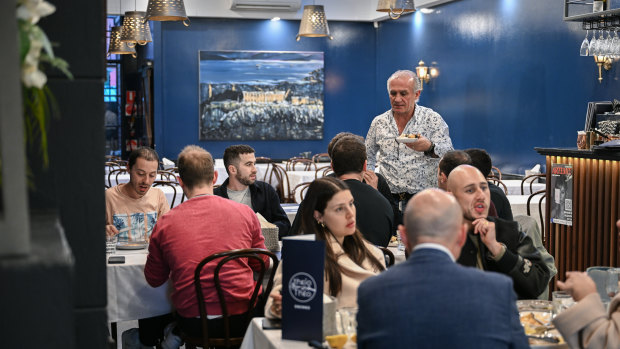 Theo Poulakidas delivers dishes at his restaurant Theio Theo.