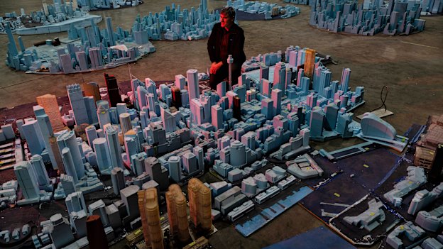 Dr Matt Glanville,  the founder of CPP Wind in Australia, with a scale model of Sydney in the company’s laboratory.