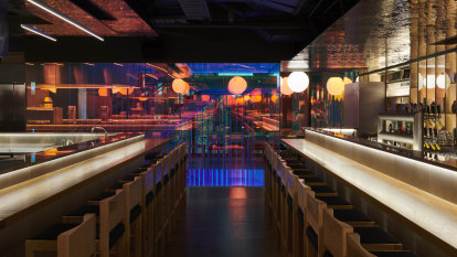 Neon lights illuminate carefully crafted Japanese-style restaurant