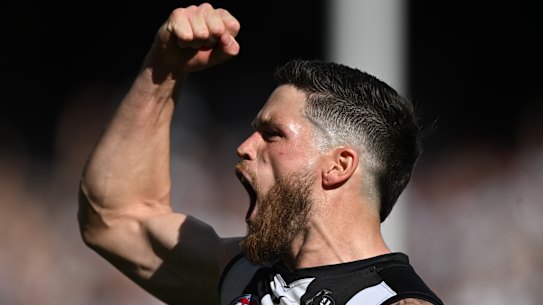 Jack Crisp celebrates one of his two booming goals in the decider.