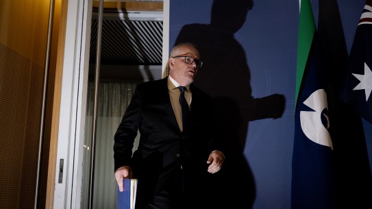 Scott Morrison enters the press conference on Wednesday.