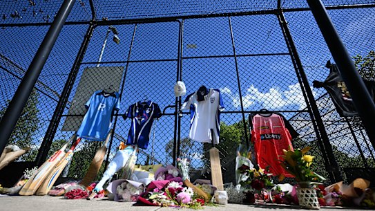 Flowers and cricket bat tributes to Ben Austin at the cricket nets at Wally Tew Reserve, Ferntree Gully on Thursday.