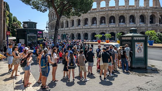 Tourists queue for water outside the Colosseum in Rome during a heatwave last summer.