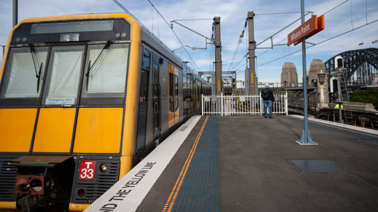 A Tangara train pulls out of Milsons Point station on a journey across Sydney Harbour Bridge on Tuesday.