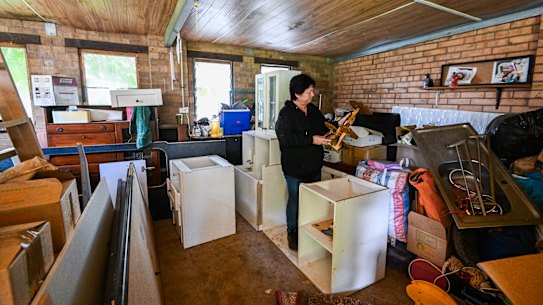 Kaye McBride in her flood-battered home. 