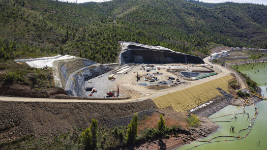Snowy 2.0 was originally slated to begin acting as a “battery for the nation” by 2021 when first championed by former prime minister Malcolm Turnbull. Construction, pictured earlier this year, is now set to last until almost the end of the decade.
