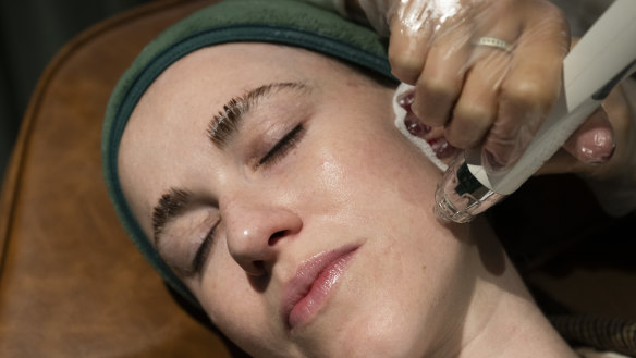 A customer receiving a skin needling treatment at the Skin Bar in Double Bay. The treatment promotes collagen growth.