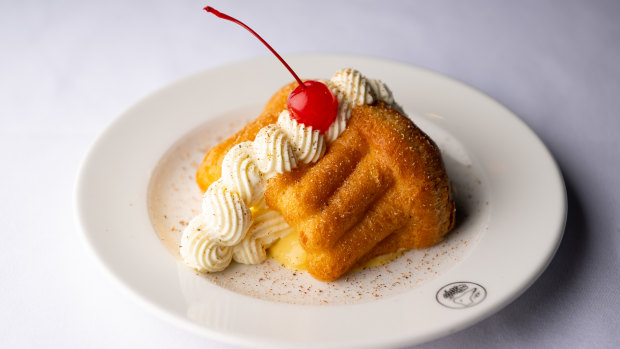 Le Foote’s rum baba with sabayon and maraschino cherry.