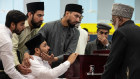 Muzafar Ahmed Tahir (bottom left), brother of Faraz Tahir, at his funeral on Friday.