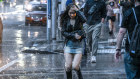 Pedestrians on Melbourne’s shopping strip Bourke Street get caught in Tuesday’s downpour.