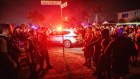 Parishioners confront police after the stabbing of Assyrian bishop Mar Mari Emmanuel on Monday night.