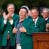 AUGUSTA, GEORGIA - APRIL 13: Rory McIlroy of Northern Ireland reacts as he is awarded the Green Jacket by Masters Champion Scottie Scheffler after the final round of the 2025 Masters Tournament at Augusta National Golf Club on April 13, 2025 in Augusta, Georgia. (Photo by Harry How/Getty Images)
