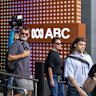 ABC staff stream out of their offices last month.