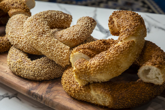 Stacks of simit, a sesame-studded bread ring that is a popular Turkish street food.