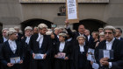 Defence barristers take part in a strike outside the Central Criminal Court, also known as the Old Bailey, in London.