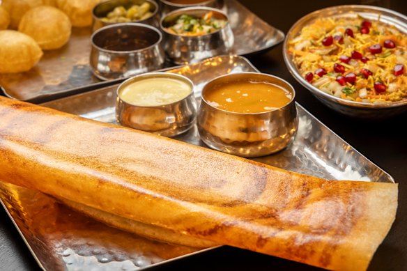 The CTR masala dosa, a rolled pancake with spiced potato filling, and accompaniments.