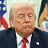President Donald Trump speaks to reporters before signing an executive order in the Oval Office.