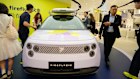 Visitors look at the new Firefly model from Chinese automaker Nio at the Shanghai Auto show on Wednesday.