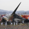 Rescue crews work at the site of the plane crash at Muan International Airport in Muan, South Korea.