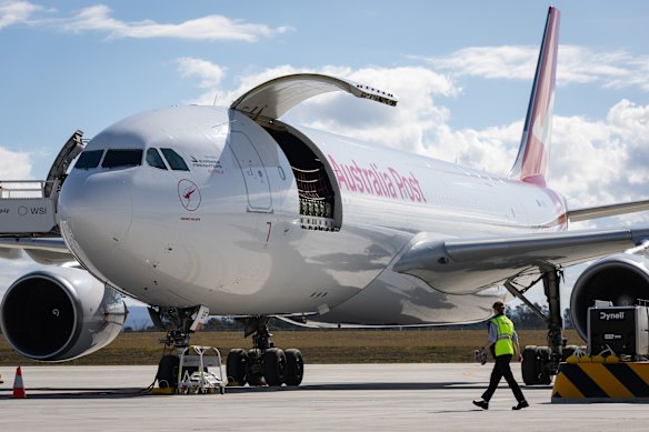 A Qantas A330 freighter is parked in front of the cargo hub on Monday.