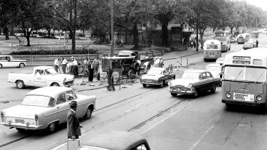 Traffic jams in Elizabeth Street, Sydney on 12 December 1961, due to workmen removing tram tracks. 