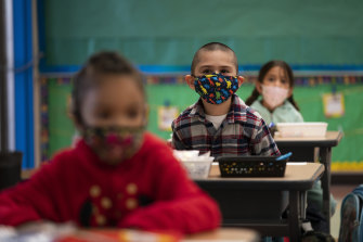 Young students wear masks at school in California.