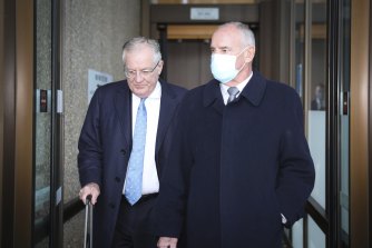 Chris Dawson (right) leaves the NSW Supreme Court on Tuesday.