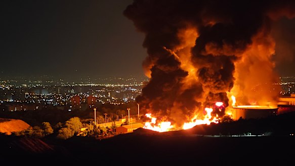 Fire and smoke rise into the sky after an Israeli attack on the Shahran oil depot in Tehran on Sunday. Oil prices across the globe are expected to climb even further if the war drags on.